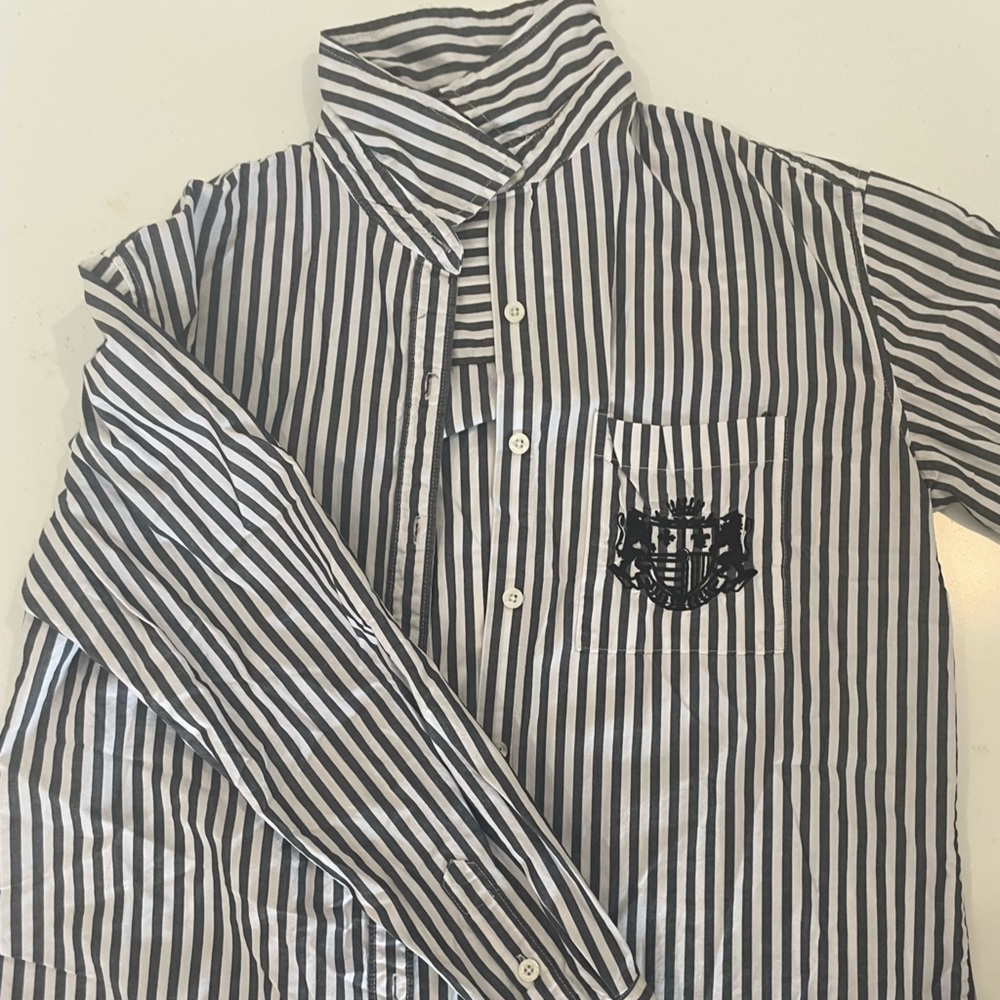 Gray and white button down flannel with a crest and white bottoms from forever21